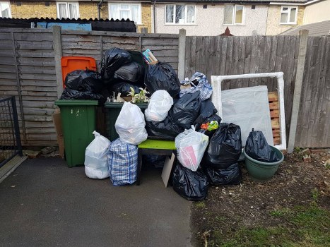 Professional team assessing a garage for clearance services